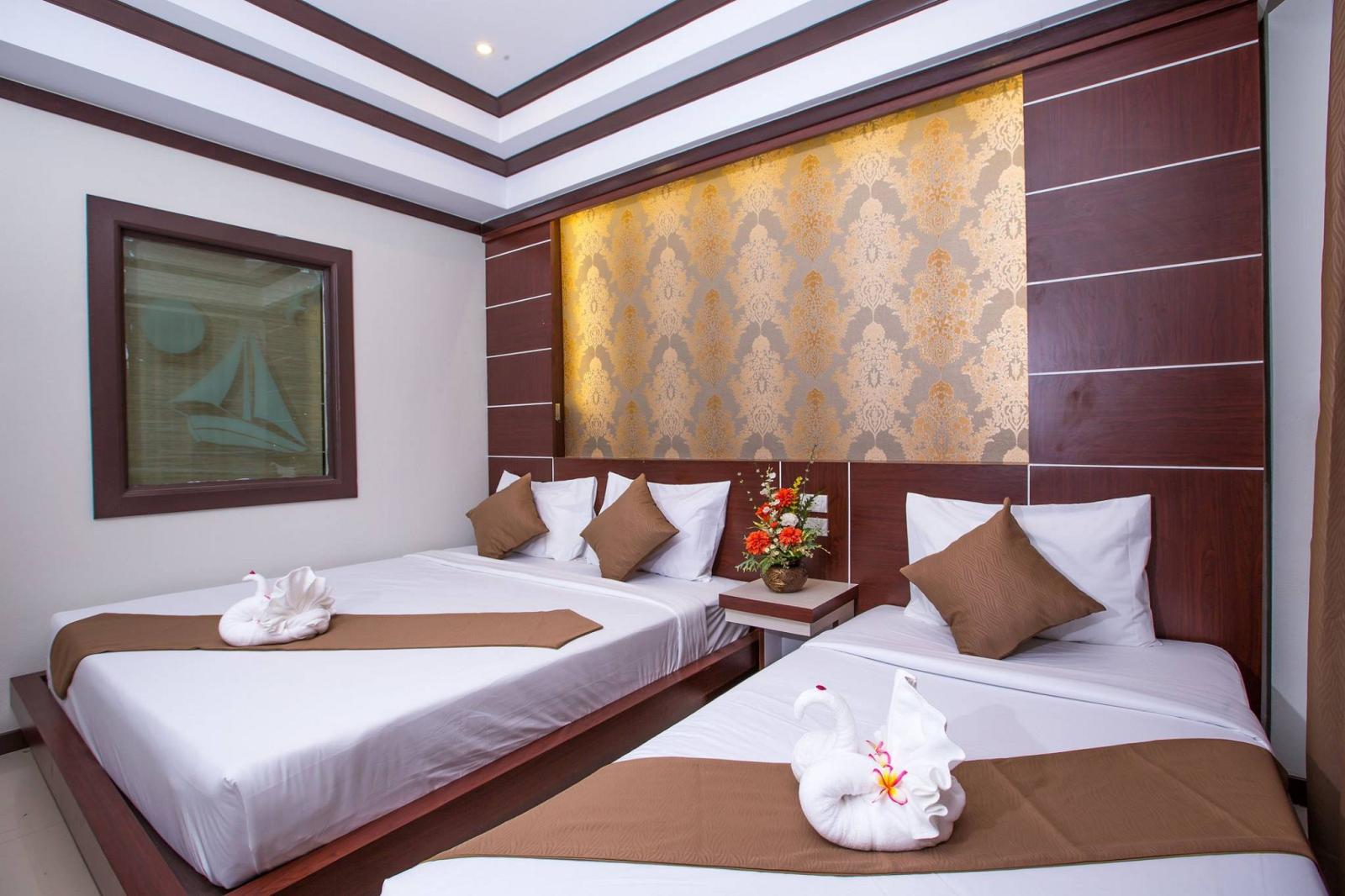Deluxe Triple Room - קופיפי אנדמן ביץ' ריזורט | Phi Phi Andaman Beach Resort - תמונה 3